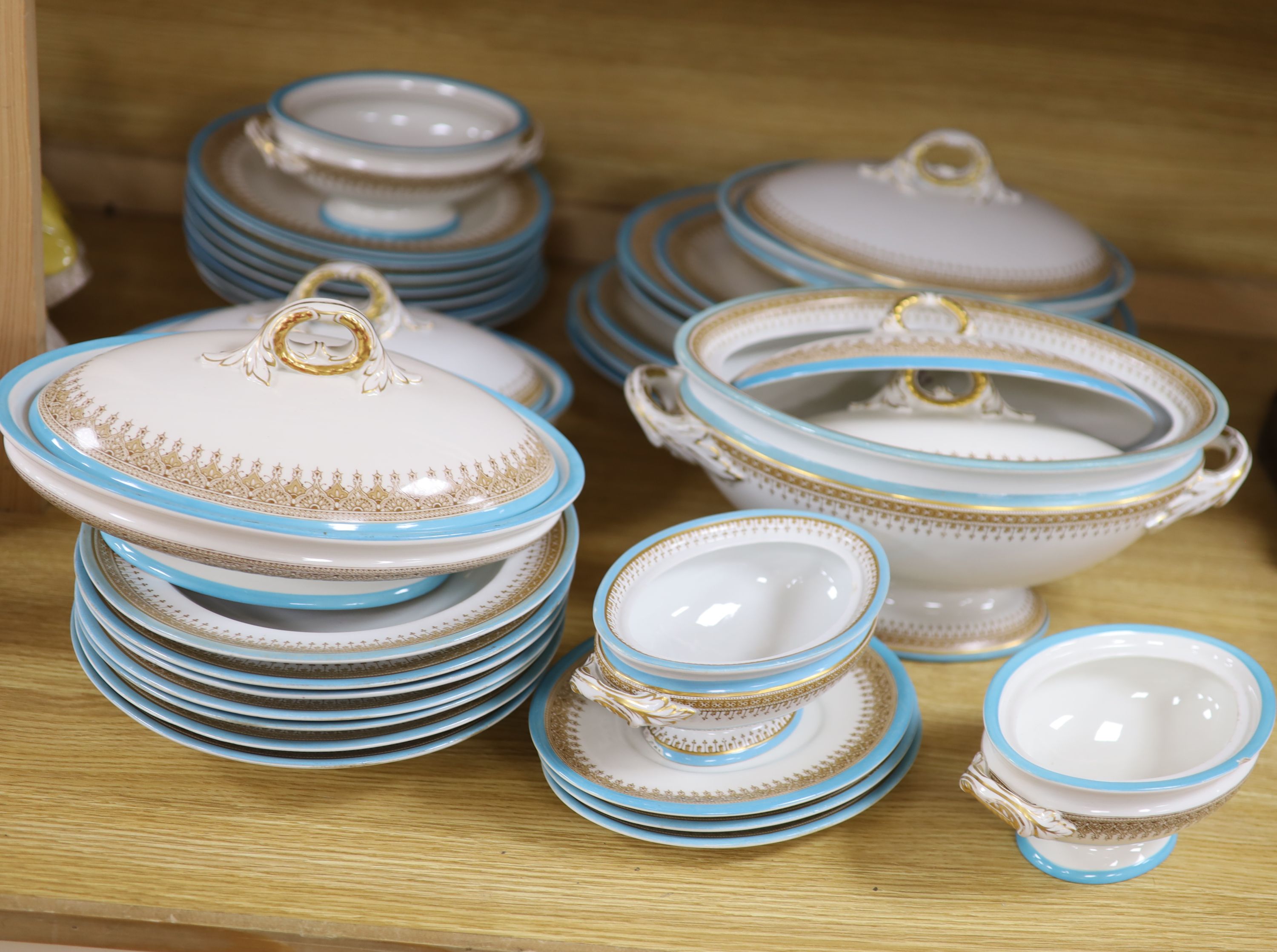 A Royal Worcester Vitreous pattern pale blue and gilt edged part dinner service including vegetable tureens